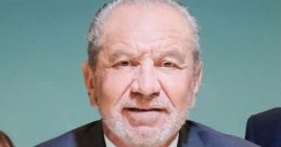 Alan Sugar in a smart suit, promoting business excellence on The Apprentice UK with a confident smile.