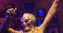 Alien character dancing enthusiastically in a lively bar scene from "Resident Alien (2021) - Season 1". Fun and quirky atmosphere.