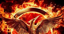 Iconic Mockingjay symbol engulfed in flames, representing rebellion in The Hunger Games: Mockingjay, Part 1 Trailer.