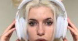 Blonde streamer with headphones, focused expression, showcasing a gaming vibe and style typical of Meowthy Streamer.