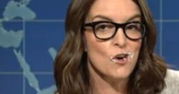 Tina Fey on Weekend Update, humorously discussing Charlottesville protests while enjoying a snack.