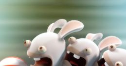 Three excited Rabbids from Rabbids Invasion cling to each other, preparing to launch a colorful beach ball in a playful scene.