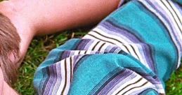 Close-up of a boy's striped shirt in vibrant colors, evoking a nostalgic feel from the Boyhood trailer's themes.