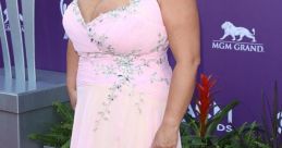 Beth Smith in a stunning pink gown with embellishments, posing confidently at the ACM Awards red carpet event.