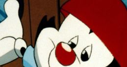 Wakko Warner animated character with a playful smile, wearing a red hat and blue shirt, from Animaniacs by Jess Harnell.