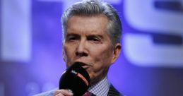 Michael Buffer announces a boxing match, showcasing his signature style and charisma with a microphone in hand.