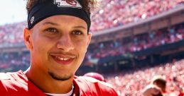 Patrick Mahomes smiles in his Kansas City Chiefs jersey, showcasing team spirit and confidence during a game day.