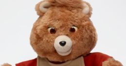 New Teddy Ruxpin plush toy with soft fur, friendly expression, and colorful outfit, perfect for children's adventures and storytelling.