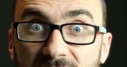 Vsauce host with glasses, displaying curiosity and excitement about science and education in a close-up shot.