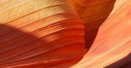 Vibrant, swirling rock formations in shades of orange and red, perfect for a Windows 7 landscape wallpaper.