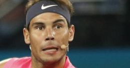 Rafael Nadal in an intense match, showcasing his powerful forehand while wearing a vibrant pink tennis shirt.