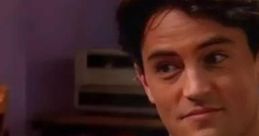 Chandler Bing smirking in a scene, showcasing his iconic humor and style from the classic sitcom Friends.