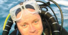 Jonathan Bird in diving gear, smiling underwater, showcasing marine exploration and adventure.