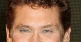 David Hasselhoff smiling, known for his role in The SpongeBob SquarePants Movie, exuding charisma and charm.