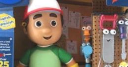 Handy Manny toy from 'Let's Get To Work!' features tools, interactive sounds in English and Spanish, perfect for creative play.