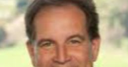 Jim Nantz smiling in a suit and tie, showcasing his charm during a professional broadcast event.