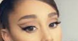 Ariana Grande with elegant makeup and accessories, showcasing her iconic style and beauty. Perfect for beauty inspiration.