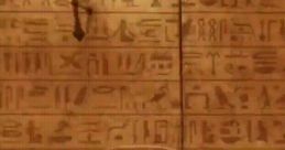 Ancient hieroglyphs adorn a stone wall, showcasing intricate symbols in an intriguing archaeological setting.