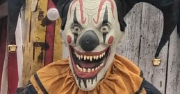 Nibbles The Clown (Spirit Halloween) It resembles a clown wearing a blue and yellow outfit with red accents, holding a