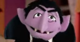 Count Von Count, the beloved purple vampire puppet, enthusiastically counts while wearing a classic tuxedo.