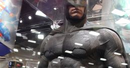 Batman display at a comic convention, showcasing the iconic dark suit and cape in a striking exhibition setting.