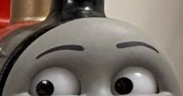 Close-up of James the Red Engine, a character from Thomas & Friends, showcasing his cheerful expression and iconic design.