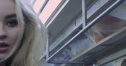 Sabrina Carpenter in a subway setting, embodying the vibe of her song "Thumbs" from the official video.