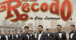 Banda El Recodo de Cruz Lizárraga poses in formal attire, showcasing their iconic style and musical legacy.