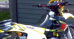 Suzuki RMX motorcycle showcasing its vibrant yellow and black design, ideal for off-road adventures and trail riding.