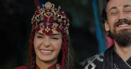 Smiling couple in ornate traditional attire, showcasing rich culture and character connection in the series Destan.