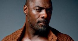 Idris Elba showcases a confident pose in a stylish brown knitted sweater, embodying the essence of "Boasty" charm.