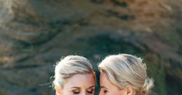 Two brides embrace, radiating love and joy in a beautiful outdoor wedding setting, celebrating their special day together.