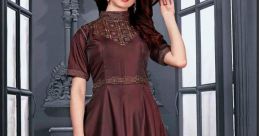 Elegant long brown dress with detailed embroidery, styled with a chic hat, perfect for formal occasions and fashion events.