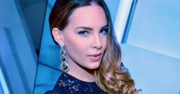 Belinda showcases a glamorous look in a sparkling blue sequined dress, exuding elegance and style at a chic event.