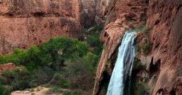 Waterfall The of a waterfall is truly a natural wonder. The rushing water crashes down over rocks and cliffs, creating a