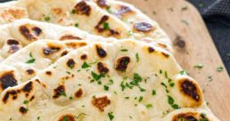 Naan The rich aroma of freshly baked Naan fills the air, enticing all the senses. As you take a bite into the warm, fluffy