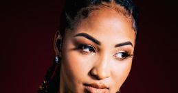 Shenseea Shenseea is known for her distinctive voice that brings a unique to the dancehall scene. Mixing elements of