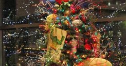 Colorful holiday tree adorned with superhero decorations, including Captain America, Hulk, and Wonder Woman, surrounded by gifts.