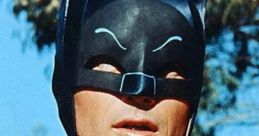 Adam West as Batman, showcasing the iconic costume, with a serious expression in a vintage superhero setting.