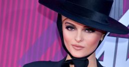 Stylish woman in a black hat and elegant outfit, celebrating "Happy Birthday Tessa!" with vibrant background.