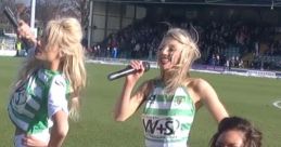 Cheerleaders performing at a football match, engaging fans with lively Newcastle United songs and entertainment.