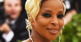 Mary J. Blige dazzles in a gold-embroidered gown, showcasing her stunning style and confidence at a high-profile event.