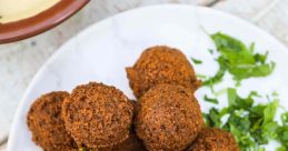 Falafel The sizzle of hot oil as it envelops the chickpea mixture, creating the crispy outer layer of a basic falafel.