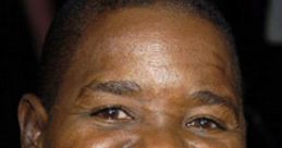 Gary Coleman smiles warmly, showcasing his iconic look and personality, a beloved figure in classic television history.