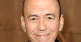 Gilbert Gottfried smiles in a formal attire, showcasing his signature humor and charm at a public event.