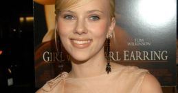 Scarlett Johansson at the premiere of "Girl with a Pearl Earring," showcasing her elegant style and youthful beauty.