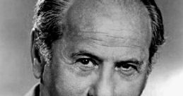 Black and white portrait of an actor with a confident expression, showcasing classic style and charisma reminiscent of Joe Pesci.