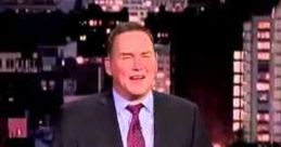 Norm Macdonald performs stand-up comedy in front of a city skyline, showcasing his signature humor and style.