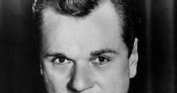 Classic black and white portrait of a man in a suit, reminiscent of vintage Hollywood charm and charisma.