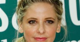 Sarah Michelle Gellar poses with a confident expression, showcasing her stylish outfit and elegant braided hairstyle.